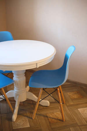 blue plastic chair and white table.の写真素材
