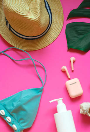 set of summer beach accessories on a pink background.の写真素材