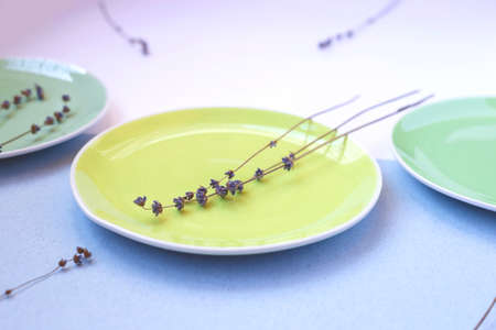 green and yellow plates on a white background. rustic style.の写真素材
