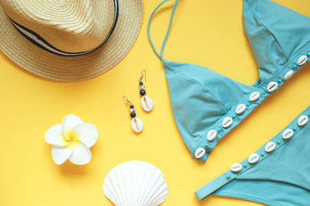 set of summer beach accessories on a yellow background.の写真素材