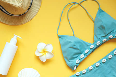 set of summer beach accessories on a yellow background.の写真素材