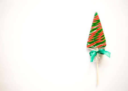 bright sweet christmas lollipop on white background.の写真素材