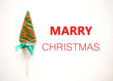 bright sweet christmas lollipop on white background.の写真素材