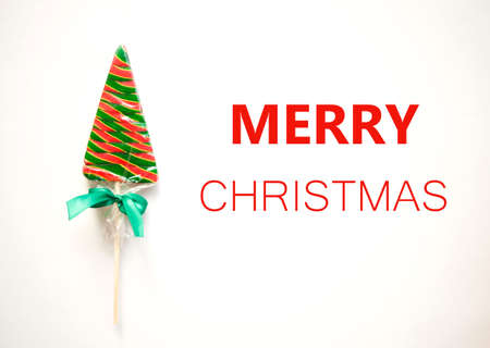 bright sweet christmas lollipop on white background.の写真素材