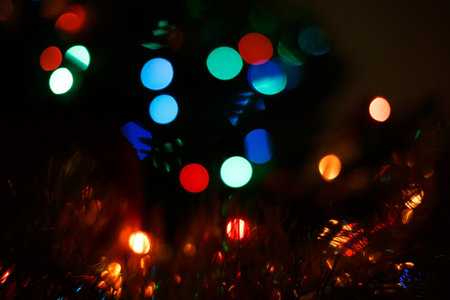 multicolored garland on the Christmas tree. blur backgroundの写真素材