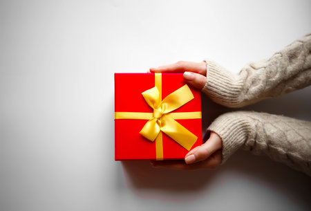 hands hold a gift on a white background.の写真素材