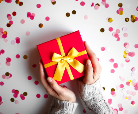 hands hold a gift on a white background.の写真素材