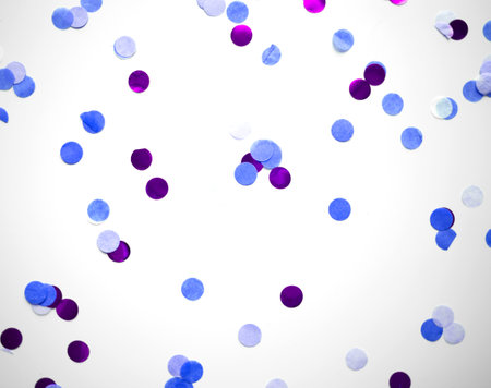 multicolored confetti on white background great background for designの写真素材