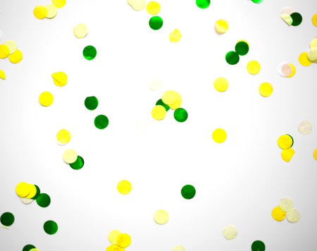 multicolored confetti on white background great background for designの写真素材
