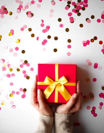 hands hold a gift on a white background.の写真素材