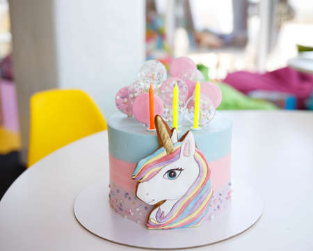 Birthday cake with candles lollipops.