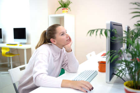 young woman is sad at the workplace. office work concep.の写真素材