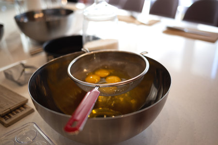 eggs in a bowl on the kitchen table for making a pie at a culinary master class.の写真素材