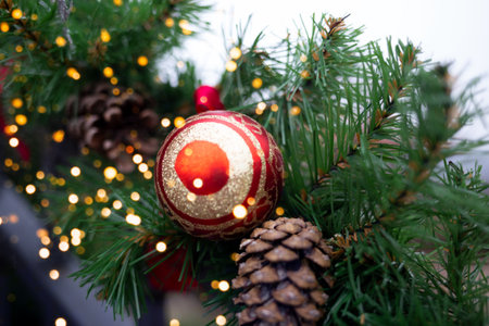 christmas decor. fir branches, cones, ribbons and christmas balls.の写真素材