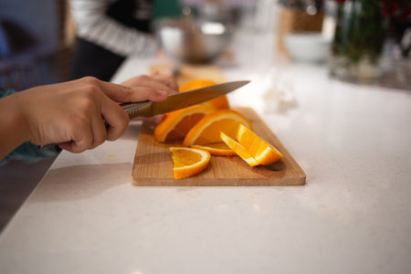 close-up shot. children's hands cut citrus fruits for making lemonade at a culinary master class.