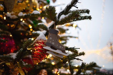 beautiful multi-colored toys on a Christmas tree against the background of lights and snow.の写真素材