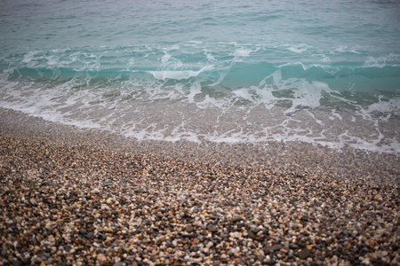 wave on the pebble shore. great background for your design.の写真素材