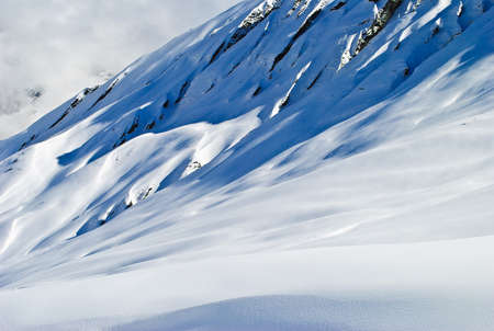 Snowy Himalayan mountains on a sunny dayの写真素材