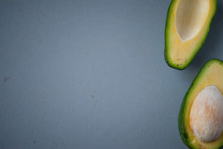 Part of halved avocado on gray backgroundの写真素材