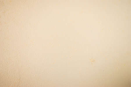 Light peach uneven wooden surface. Natural texture