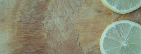 Part of ripe lemon on rustic wooden backgroundの写真素材