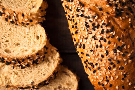 Slices of fresh baguette with white and black sesame. Close upの写真素材