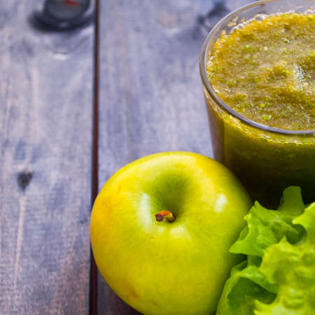 Green smoothie in glass, lettuce and apples. Copy spaceの写真素材