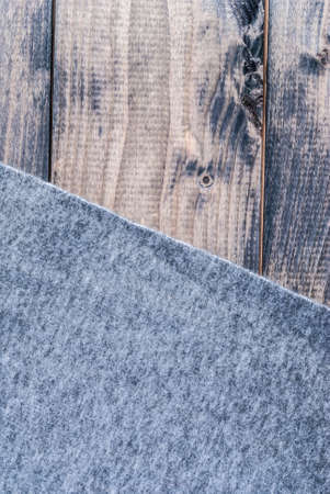 Grey blanket on a shabby wooden benchの写真素材