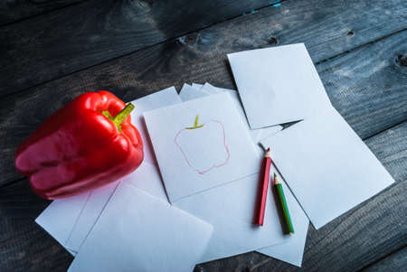 Sketch of red pepper and two color pencils besideの写真素材