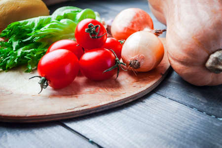 A lot of bright raw vegetables prepared for cookingの写真素材
