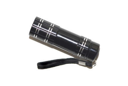 A small black LED flashlight shot from above