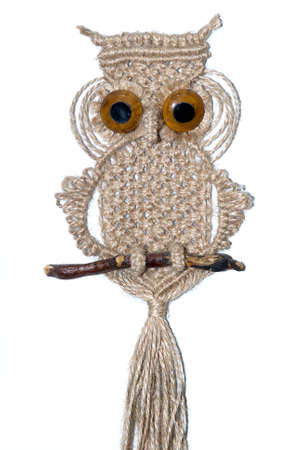 An owl woven out of cords and ropes using the art of macrameの写真素材