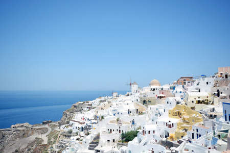 Panoramic view, Santorini island, Traditional and famous white houses and churches with blue domes over the Caldera, Aegean sea.の写真素材