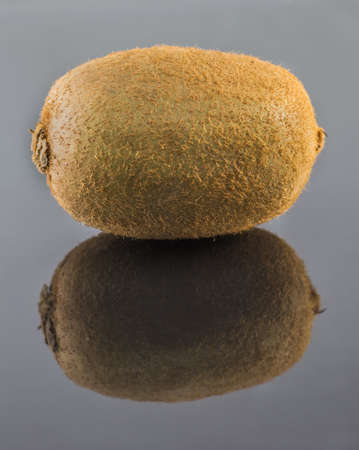 Isolated kiwi with reflection. Background. Fresh kiwi fruit.の写真素材