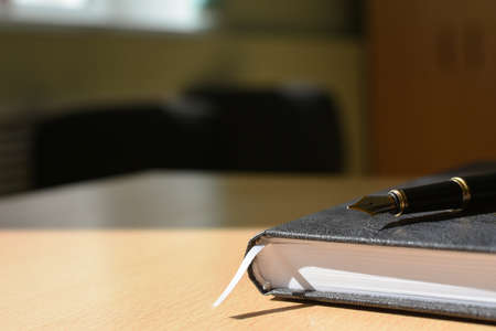 Notebook on the desktop cover, pen, business, copy spaceの写真素材