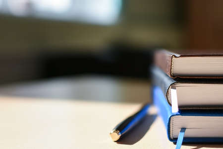 Notebook on the desktop cover, pen, business, copy spaceの写真素材