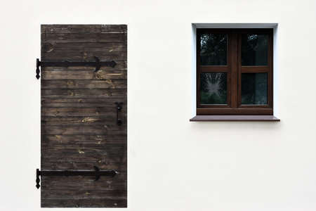 Simple picture of a door and a window on the wallの写真素材
