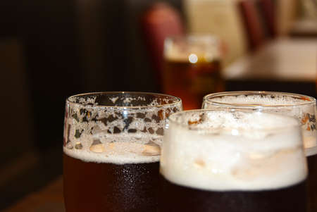 Glasses with a light beer on the barの写真素材