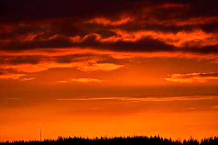 Bright red sunset in the sky with clouds, copy spaceの写真素材