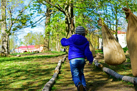 Child playing in an amusement parkの写真素材