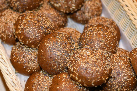 Beautiful delicious rolls, croissants, cakes and bread in the basket