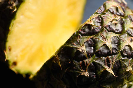 Close-up juicy cut pineapple on the kitchen tableの写真素材
