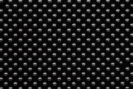 Background metal pins with balls on a purple, blue and black wallの写真素材