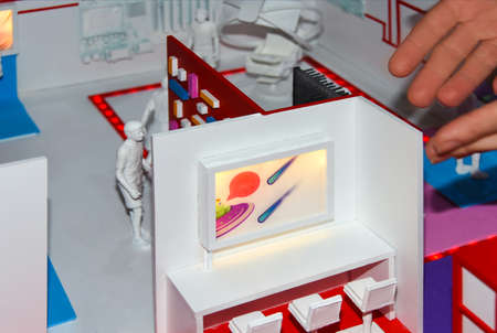 Figures of people in a miniature educational class on teaching information technology of the future. Miniature people : Teacher and children. Education concept.の写真素材