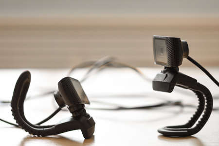 Two cameras shoot each other from top bottom on the tableの写真素材