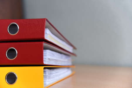 Large color folders for documents on the table in office, close-up, copy spaceの写真素材