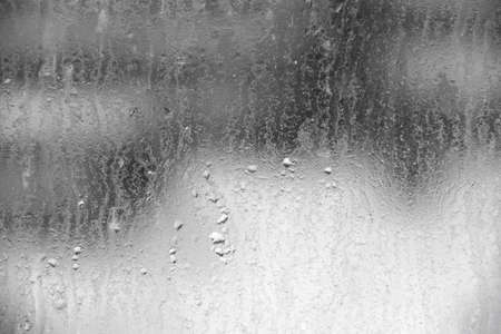Background texture of water drop on dirty glassの写真素材