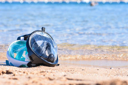 Two masks for snorkeling on sandy beach near the sea, copy Spaceの写真素材