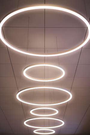 Modern ring lamp on  ceiling, line, lighting, interiorの写真素材