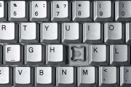 Broken button on computer keyboard, close-upの写真素材